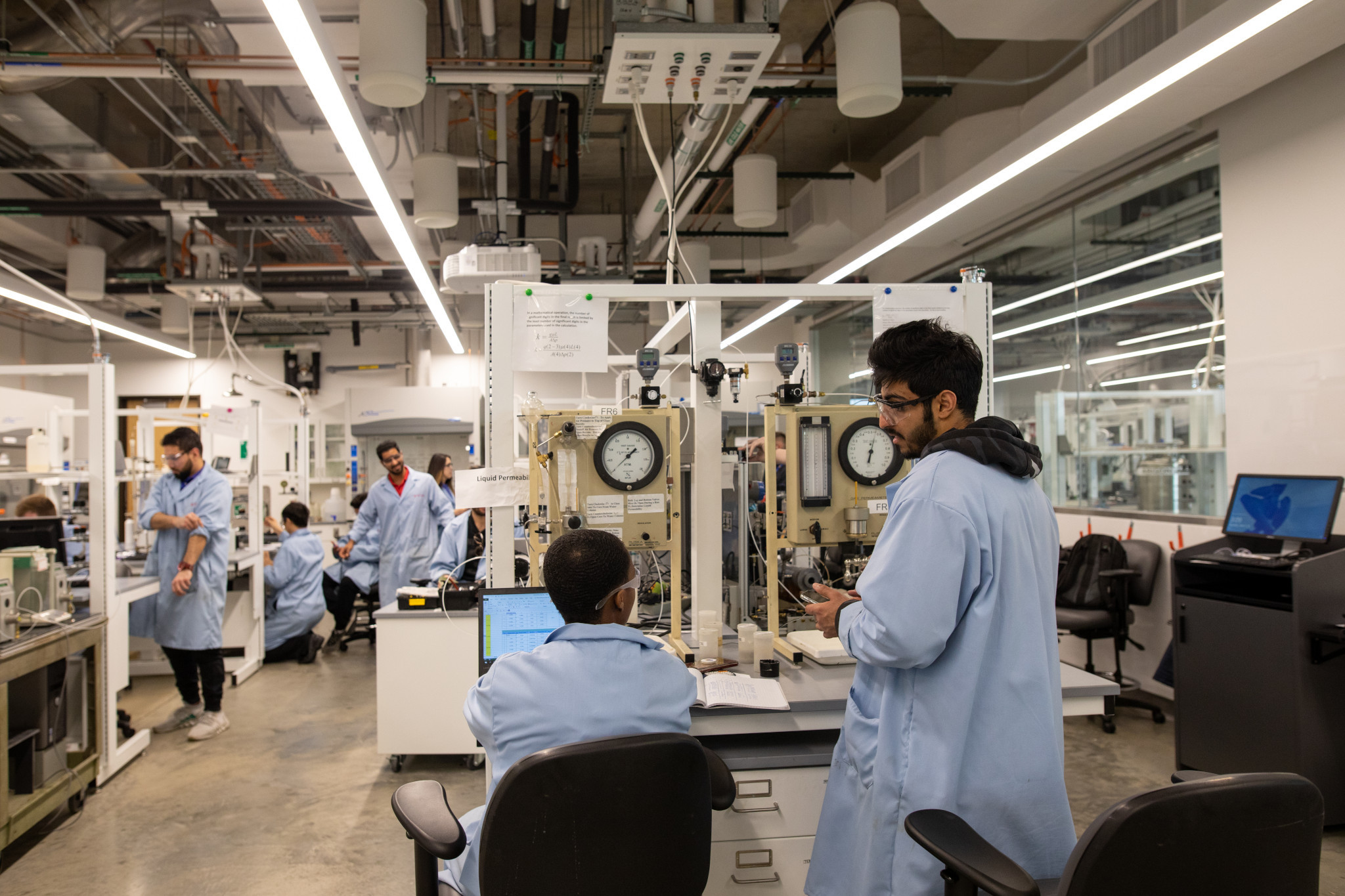 Several students working in the petroleum senior design lab