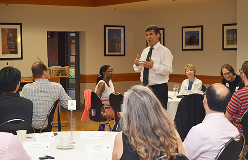 Shahin Negahban speaking to a group of students and faculty