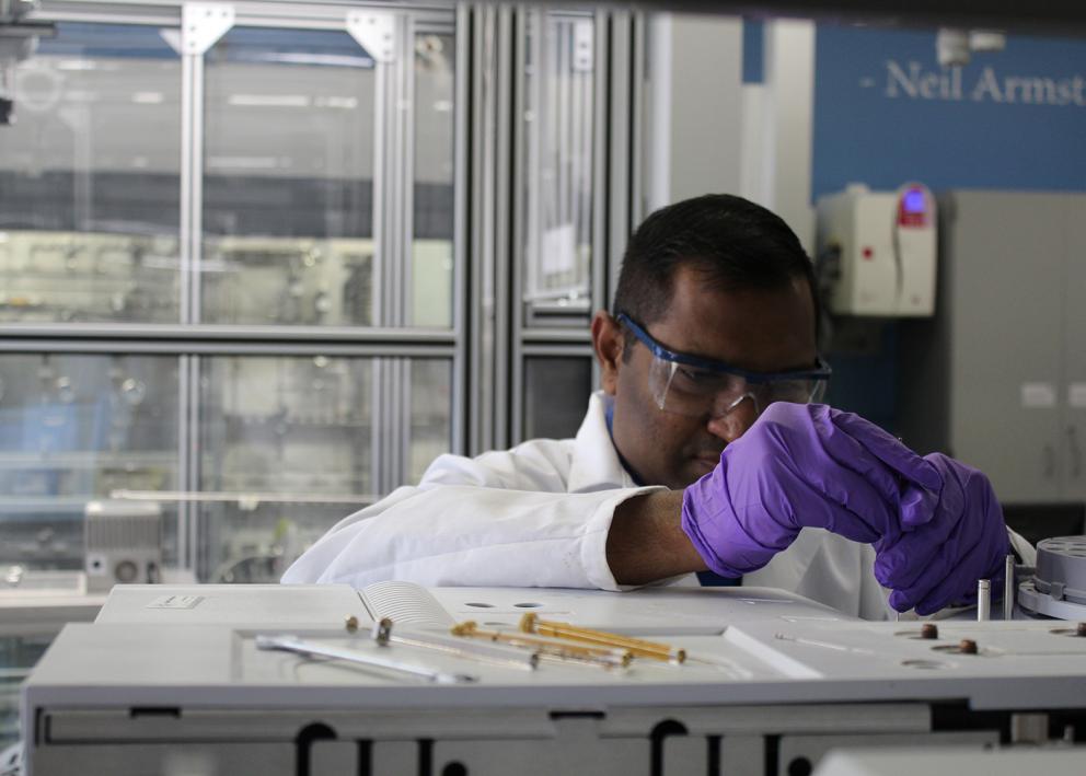 Post-doctoral researcher, Rajkumar Kore, working in the Shiflett lab wearing PPE