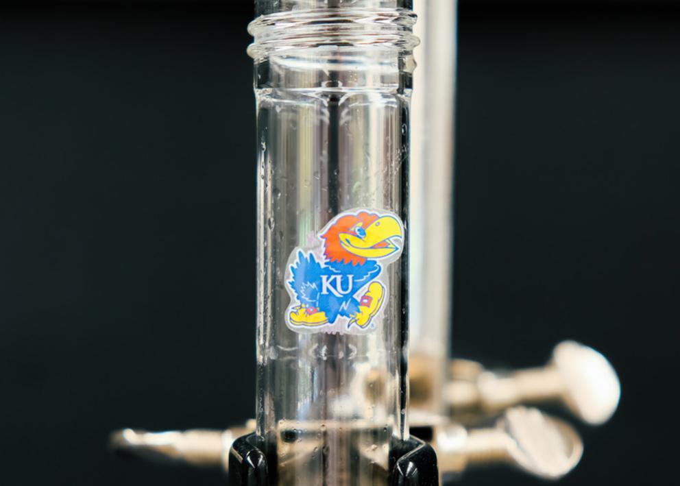 a piece of glassware with a KU jayhawk logo 