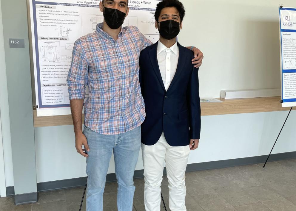 REU student Abdul with his graduate student mentor Karim at the REU poster session