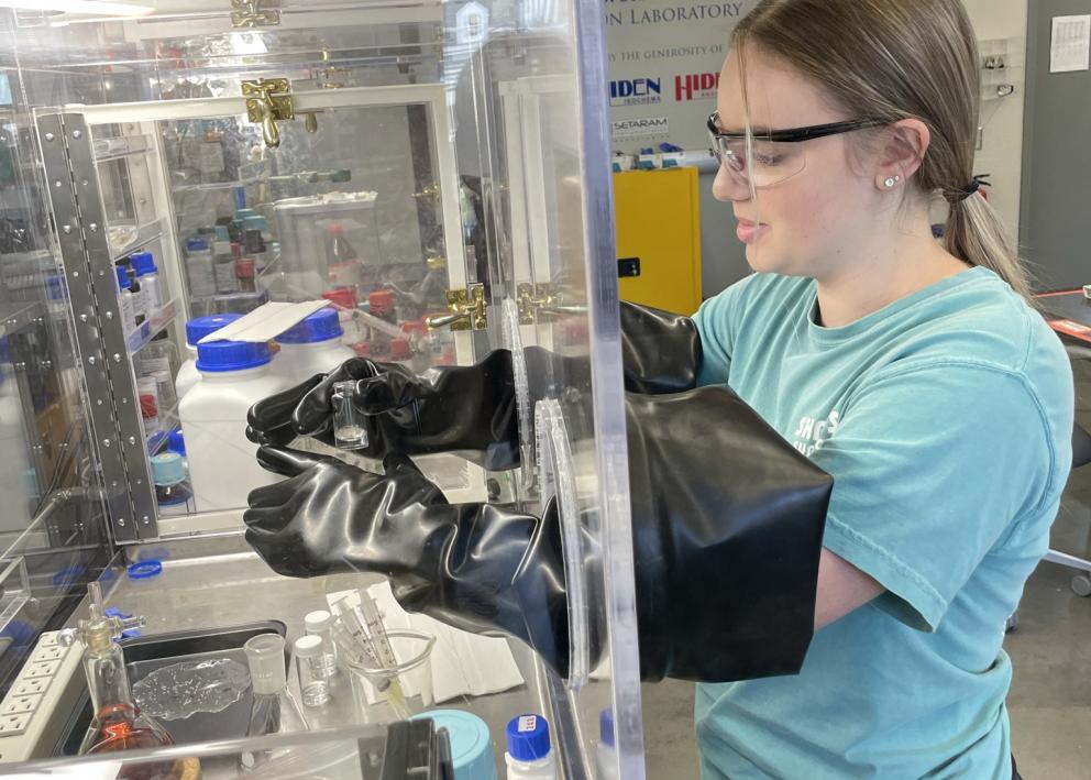 Student working in glove box