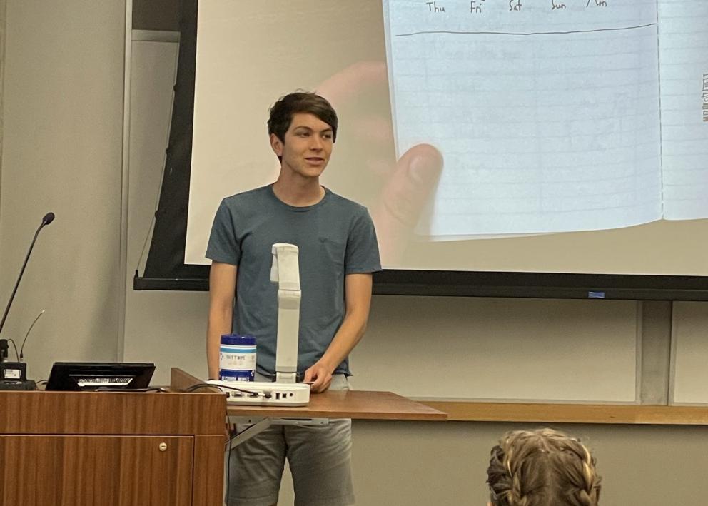 Student explaining their drawing of a scale concept