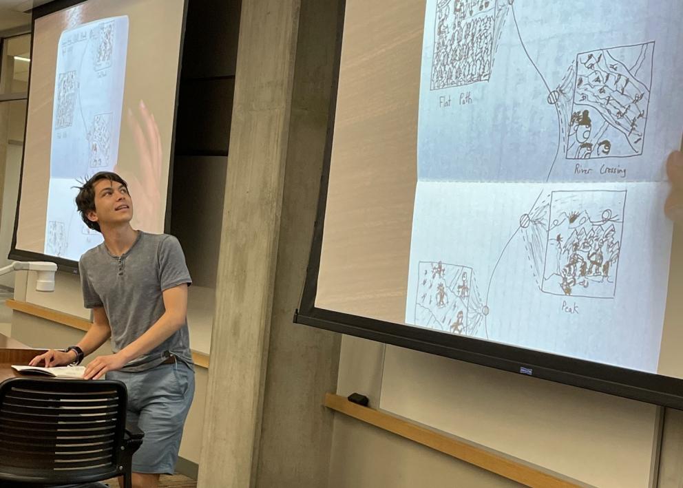 Student explaining their drawing of a journey