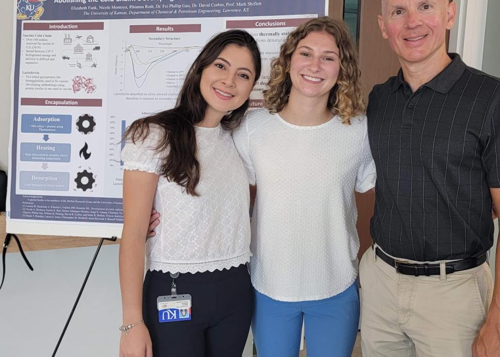 Elizabeth with her graduate student mentor Nicole and faculty mentor Mark Shiflett at REU poster session