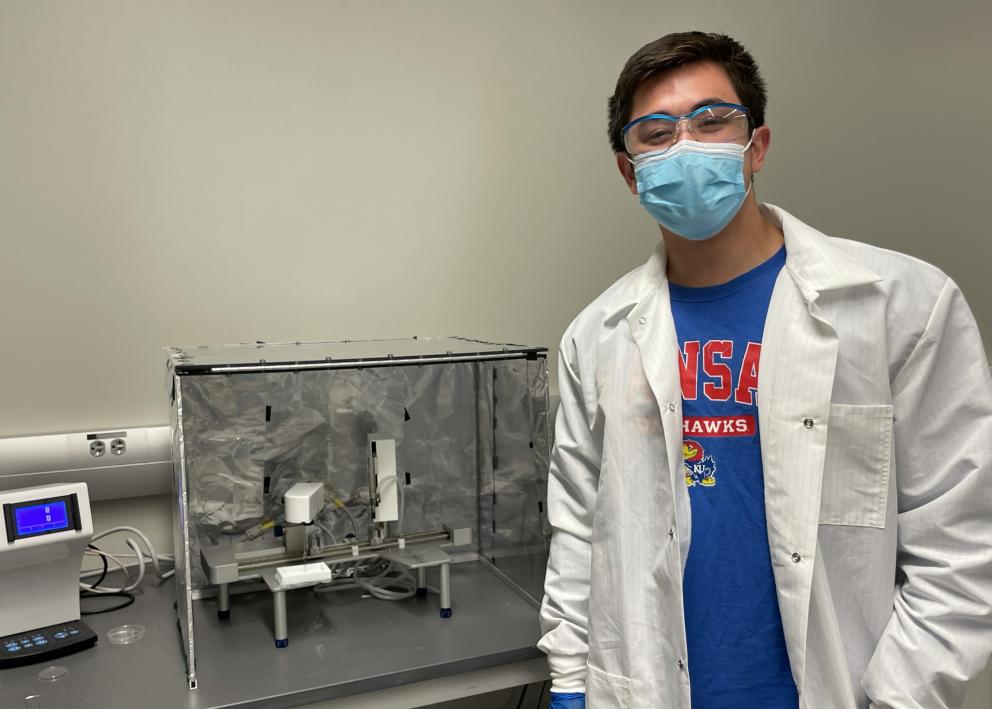 Student next to experimental apparatus