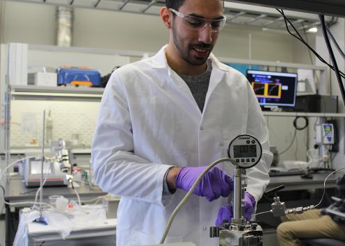 Graduate student Karim Al-Barghouti from the Scurto group working in the lab