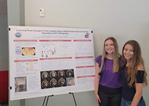 Dorothy and her graduate student mentor Kalin at the REU poster session