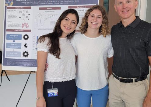 Elizabeth with her graduate student mentor Nicole and faculty mentor Mark Shiflett at REU poster session