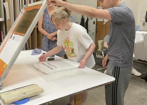 REU students Julia and Gustavo learning to screen print
