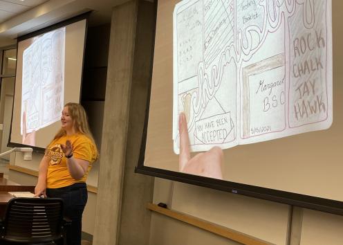 Student presenting their artistic drawing for a workshop on communicating science