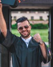 Abdullah in his graduation cap and gown