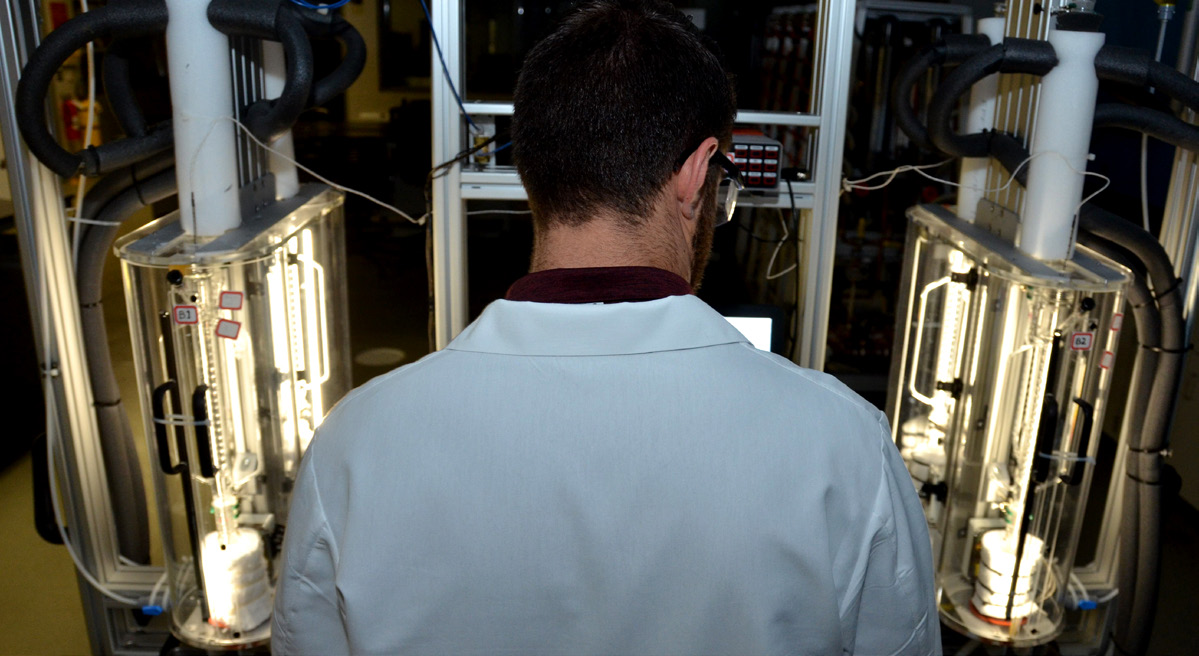 researcher working at a station in a lab